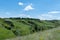 View ravine covered with greenery. Landscape valley with geological faults.