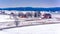 View of red barns and snow-covered farm fields from Longstreet T