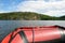 View from a red inflatable boat in Ladoga Skerry lake. Islands and mountains