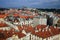 View of the red roofs of Mala Strana and St. Vitus Cathedral in Prague