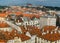 view of the red roofs of Mala Strana and St. Vitus Cathedral in Prague