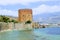 View of Red Tower and fortress wall from the old shipyard Alanya, Turkey