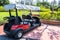 View of red traveling golf cart parks at Ancient City or Ancient Siam or Mueang Boran,