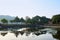 View of the reflection of a gazebo and the trees at Uirimji Reservoir in Jechun, South Korea