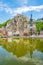 View at the reflection of houses and church of Our Lady Assumption in Dinant - Belgium