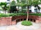 view of relaxing zone, Brick chair relaxing in the garden.Relax corner with many kind of green trees.