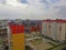 View of residental area with multi-storey buildings and parking, autumn