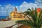 View on resort city Camogli with cloudly sky and palm