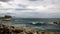 View of the restless Gulf of Naples with a great-looking wave and a castle Castel Dell`ovo