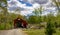 View of a Restored Burr Truss Covered Bridge on a Country Road With Stone Approach Walls