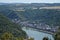 view into a Rhine valley with small town Oberwesel, red church and castle on the left