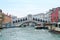 View of Rialto Bridge on Grand canal with Vaporetto passanger boat stop