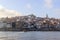 View of the Ribera from the opposite riverside of the river Douro, Porto, Portugal. Colorful houses of old town on the embankment