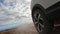 View of the right rear wheel of the SUV car. Close-up. An exciting road adventure.View of the right rear wheel of the SUV car. Clo