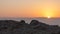 View  of the rising sun over the mountains of Jordan from the ruins of the fortress wall of the fortress of Masada - is a fortress