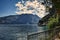 view from Riva del Garda to mountains, lake, water, pier, promenade, waterfront, blue sky