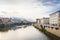 View of the river Arno, Ponte Vecchio bridge and pleasure boats in Florence in the evening in watercolor tones