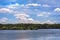 View of the river bank.The clouds are reflected in the water.Blue sky with scenic white clouds.