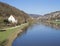View on river Berounka from pedestrial bridge in village Srbsko in central Bohemian region on on spring sunny day, blue
