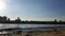 View of the river and the city on the horizon. View of the river with sailing catamarans and boats.