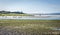 A view river doon estuary with canoeists and a photographer