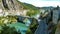 View on river durance with old bridge and village at food of mountain - Sisteron, Provence, France focus on village left