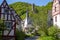 View at river elz, half-timbered houses and castle Loewenburg in the background