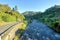 View of a river flowing alongside a road