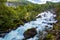 View of the river Geirangerelvi and the waterfall Storfossen in Geiranger, Norway