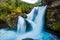 View of the river Geirangerelvi and the waterfall Storfossen in Geiranger, Norway