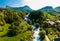 View of the river Geirangerelvi and the waterfall Storfossen in Geiranger, Norway