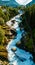 View of the river Geirangerelvi and the waterfall Storfossen in Geiranger, Norway