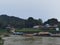 View of the river, harbor boats and Kuala Tahan village in Taman Negara National Park in Malaysia