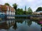 View on the river Ilmenau with building and tower on shore in the German medieval town of Lueneburg.