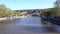 View of the River Kura, a glass bridge of peace and the cable car. The movement of cars on both sides of the river. Tbilisi