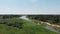 View of the river, meadow and forest from above.