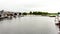 View of the river Shannon with boats anchored on the shore with a park with in the background