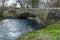 A view of  the River Syfynwy flowing under an eighteenth-century bridge at Gelli, Wales