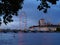 View of the River Thames with Westminster Bridge, London Eye and the architectural buildings of the South Bank at dusk.