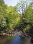 View of the river and valley at lumb hole in woodland at crimsworth dean near pecket well in calderdale west yorkshire