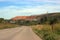 View of the road adjacent to the embankment near the Siberian town