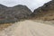 View of the road and next to the Tecllo lagoon, the mountains and the road in the morning in Shupluy