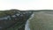 View of road passing through dramatic river gorge. Shot. Top view of rural road in narrow abyss of gorge. Dangerous