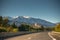 View from road to Vinca, a french village in Eastern Pyrenees and snow capped Canigou peak