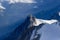 View of the rock of Aiguille du Midi from top Mont-Blanc mountain, France, by beautiful weather