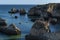 View of the rock formations at the Ponta Joao de Arens, near the Alemao Beach Praia do Alemao on a summer day, with boats on the