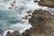 View Rocks against waves of Coast Great Ocean Road Victoria Australia nice