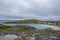 View from the rocks to the fishing village Bugoynes Pykeija and Barents Sea, Varangerfjord, Norway