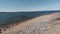 View of the rocky beach of the Minsk Sea from behind a tree