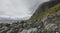 View on a rocky beach on Vaeroy island ( Værøy ) on Lofoten archipelago with a moody stormy sky